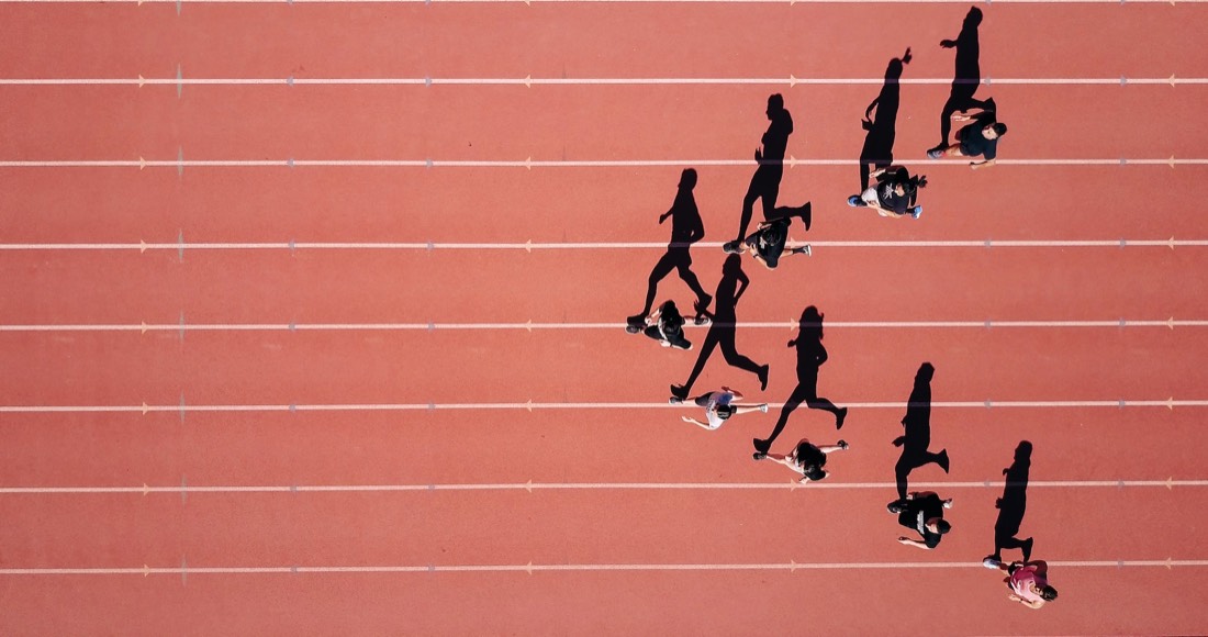 Athletes running on track — sports excellence in action