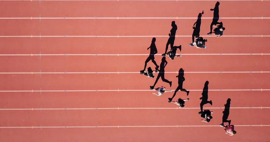 Athletes running on track — sports excellence in action